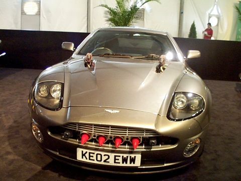 1999 Ford Taurus - Front view of a silver Aston Martin Vanquish with a distinctive grille and license plate.