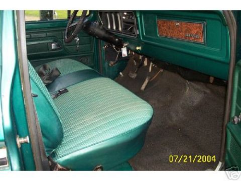 1973 Ford Ranchero - Interior view of a 1973 Ford Ranchero, highlighting the green seat and dashboard details.
