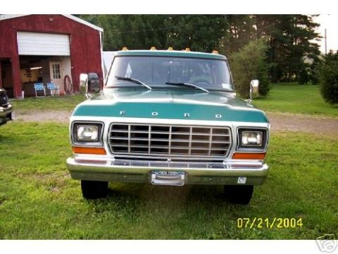 1973 Ford Ranchero - This Ford pickup truck has a prominent grille and is parked in front of a red barn.