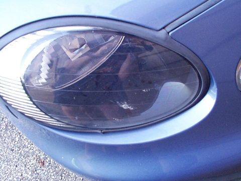 1999 Ford Taurus - This headlight's design suggests a 1998 model year, not the claimed 1999 Ford Taurus.