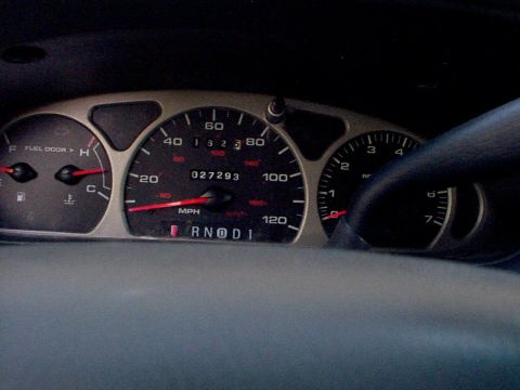 1999 Ford Taurus - The dashboard shows the vehicle's current mileage and fuel level, with the gear selector in Park.
