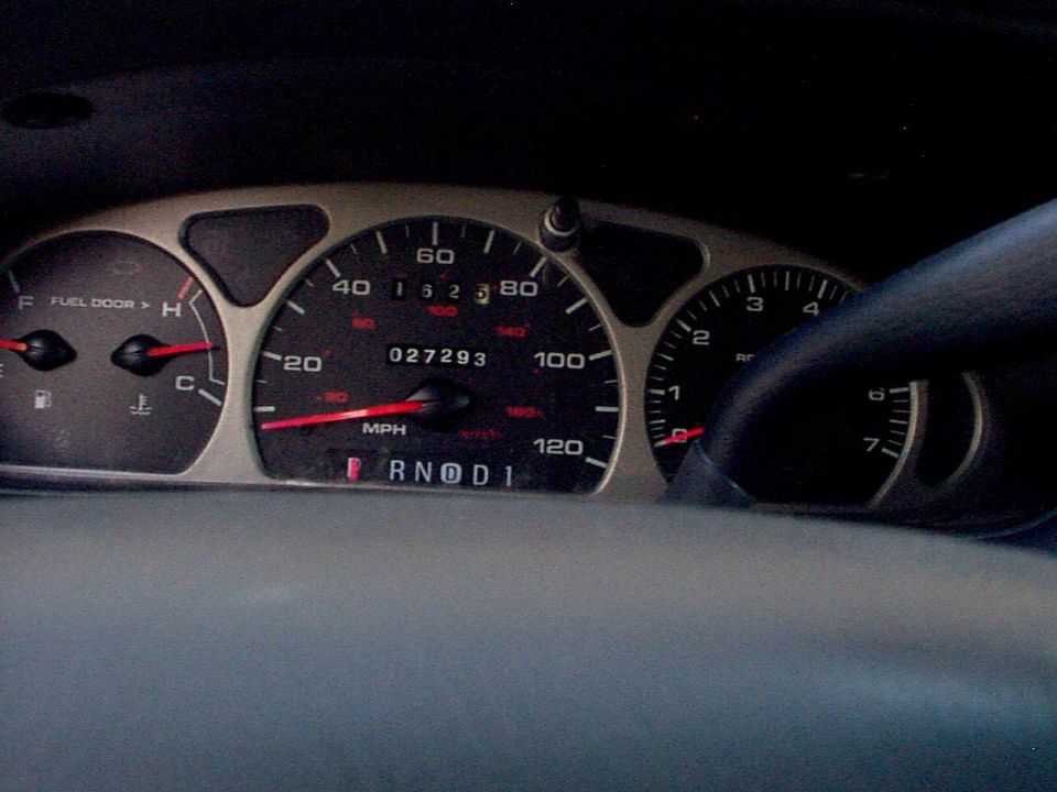 Speedometer reads 0, odometer shows 27,293 miles. Fuel and temperature gauges visible