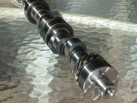 1979 Ford Bronco - A close-up view of a metal camshaft, a critical engine component.