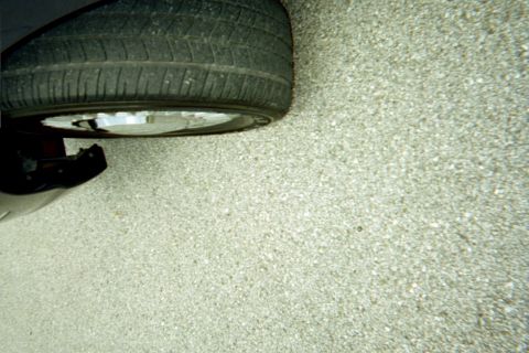 1998 Ford Crown Victoria - A close-up view of a vehicle's wheel and fender, with a "SuperMotors" watermark visible.