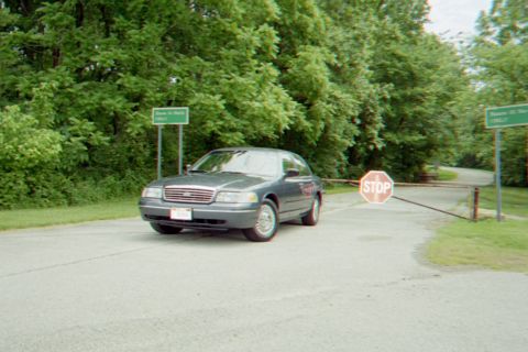 1998 Ford Crown Victoria - A 1998 Ford Crown Victoria is seen at a road closure with a stop sign.