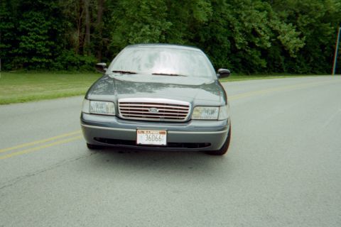 1998 Ford Crown Victoria - This 1998 Ford Crown Victoria is seen from the front, its distinctive chrome grille and headlights.
