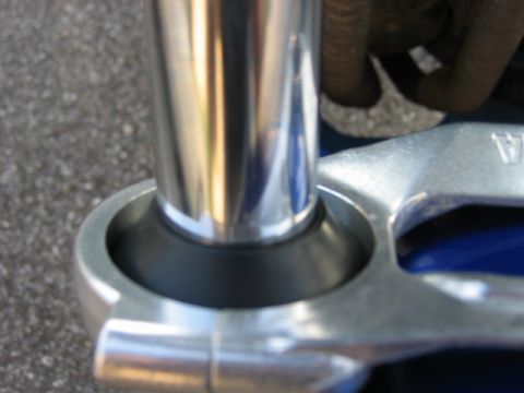 1985 Ford Crown Victoria LTD - Detail of a motorcycle's front suspension fork, showing the stanchion and clamp assembly.