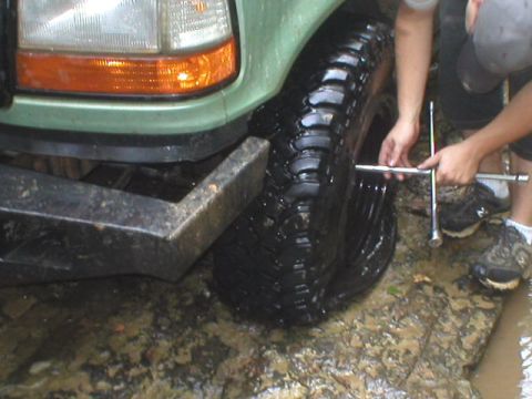 1989 Ford Bronco - D'oh!! Just 5 minutes into the creek and Blaze sliced his tire.