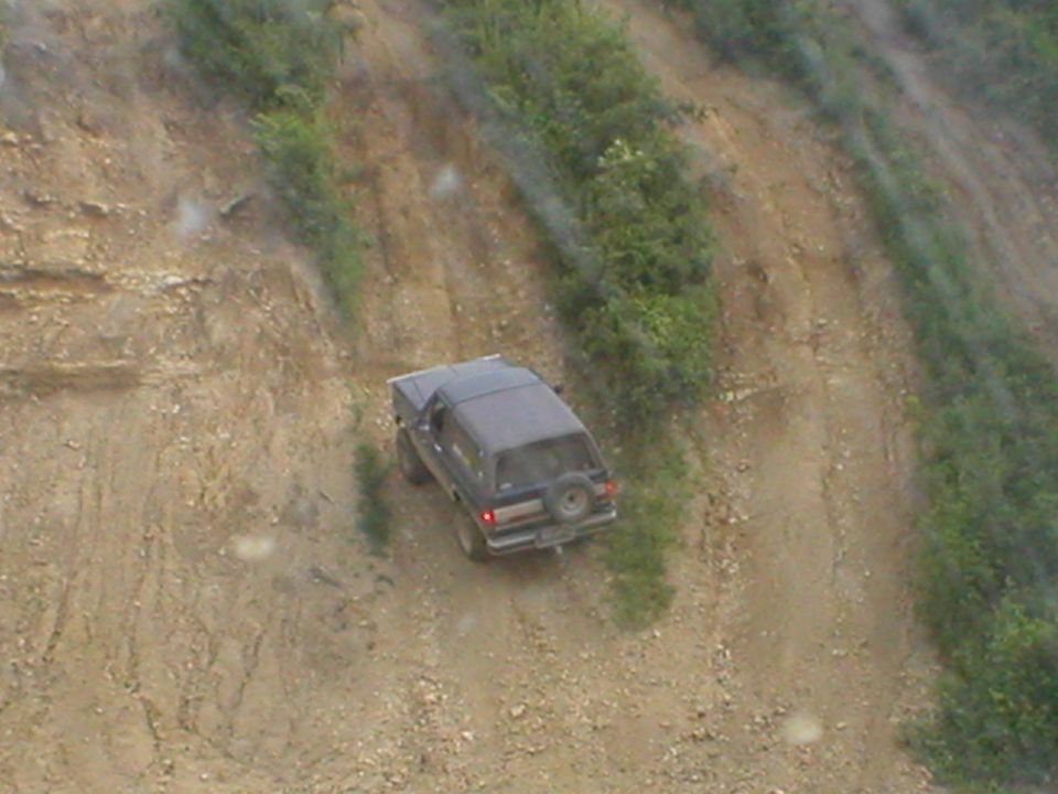 Mosley sliding down a tuff hill