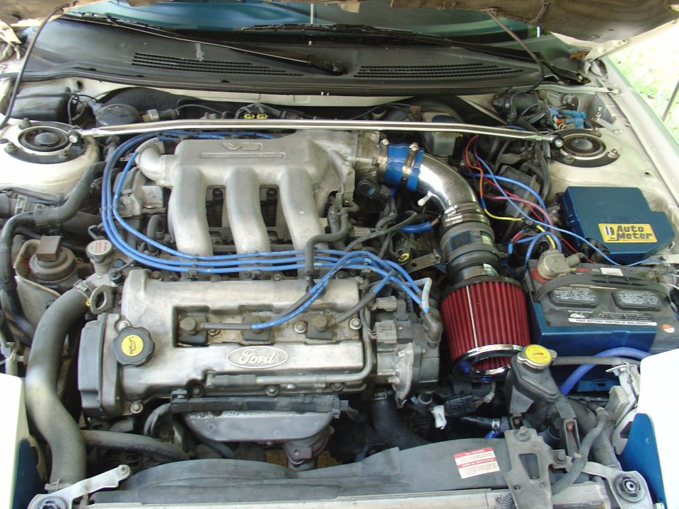 1993 Ford Probe engine bay with V6 engine and aftermarket air intake