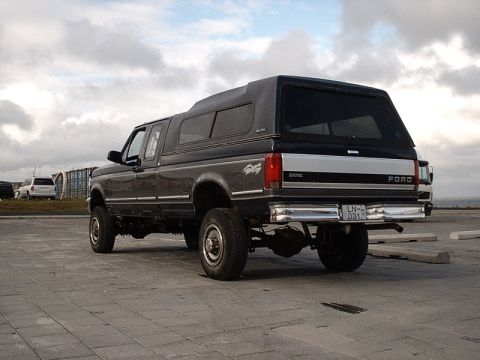 1996 Ford Bronco - This 1996 Ford Bronco, equipped with a camper shell, is seen from the rear with its license plate visible.