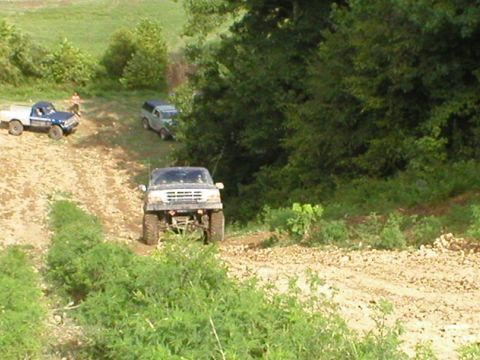 1986 Ford Bronco - "AIR" Jon making a hill climb.