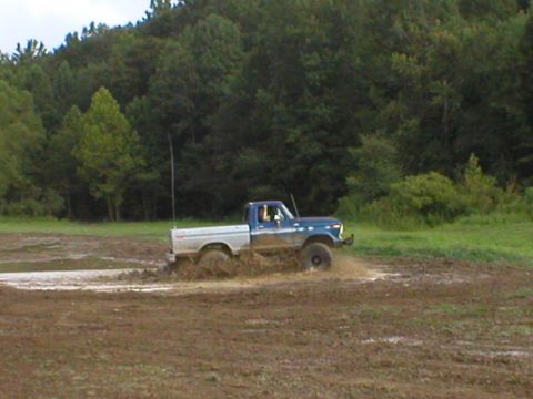 1986 Ford Bronco - Dale, his buddy, and little boy Kyle kicking up the mud