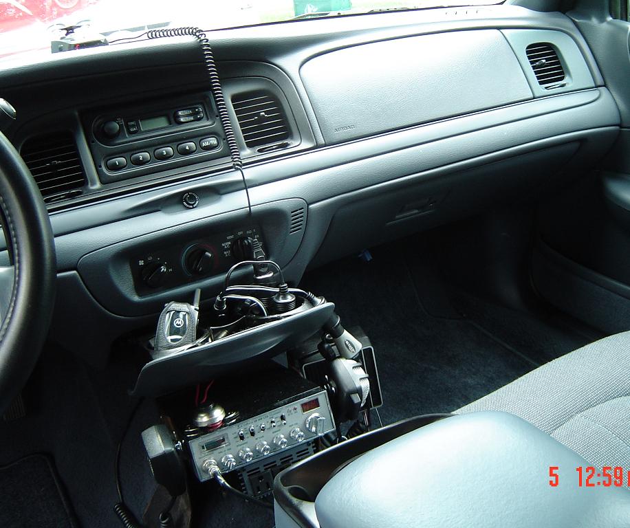 Interior of a 1999 Ford Crown Victoria with CB radio and scanner
