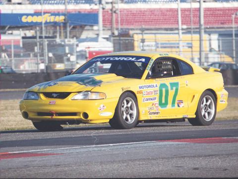 1995 Ford Mustang - This yellow 1995 Ford Mustang, number 07, displays Motorola sponsorship while competing on the track.