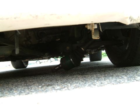 1990 Jeep YJ - Underside view of a vehicle's driveshaft and suspension components, with a watermark for Supermotors.net visible.