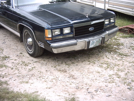 Dark blue 1990 Ford Crown Victoria LTD front view with chrome grille and license plate 188-7193