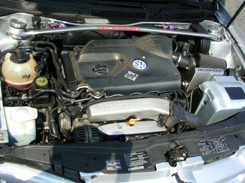1990 Jeep YJ - The engine bay features a Volkswagen engine with a Neuspeed intake system and a strut bar.