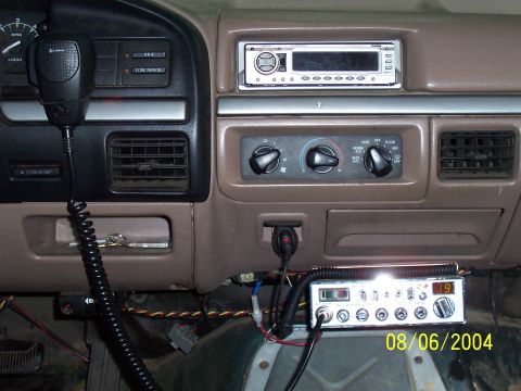 1994 Ford Bronco - Interior view of a vehicle's dashboard, highlighting a CB radio and other electronic accessories.
