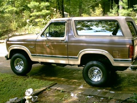 1984 Ford Bronco - This two-tone brown SUV displays a body style consistent with the early 1980s Ford Bronco generation.