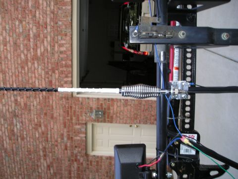1996 Ford Bronco - This image shows a close-up of a vehicle's antenna mount, a spring and various electrical connections.