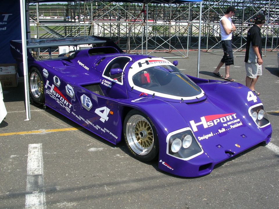 Purple HSPORT Porsche race car with number 4 on side