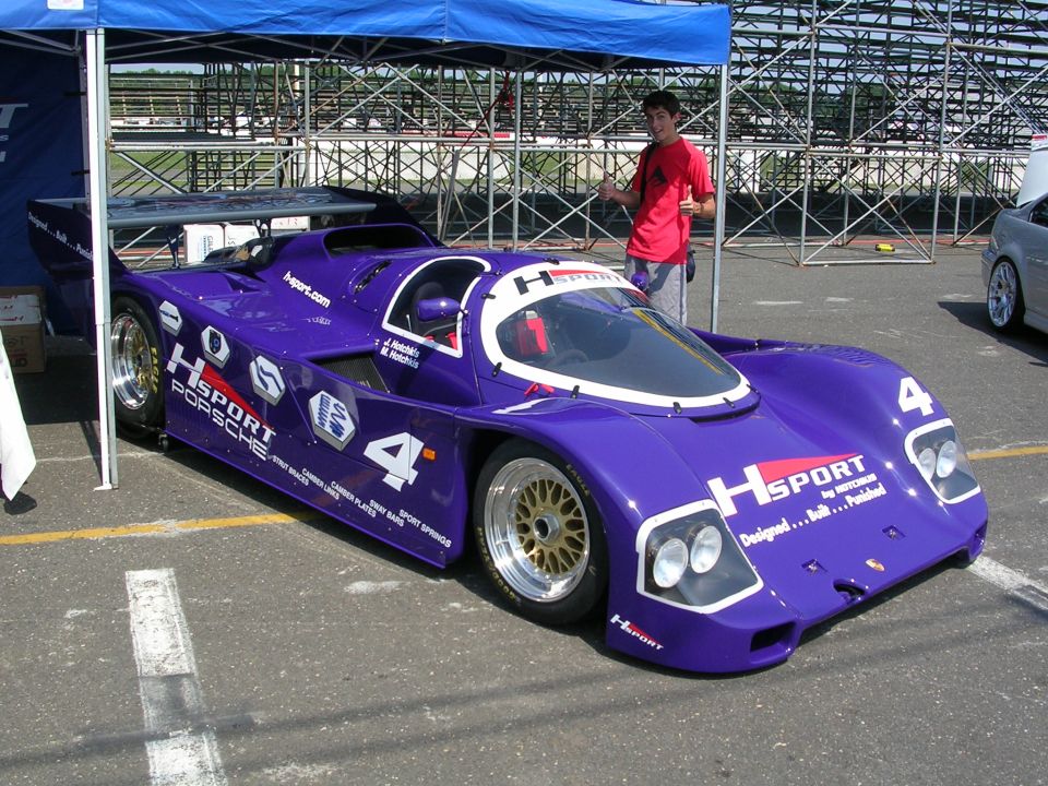 Purple racing car with HSPORT and Porsche decals, number 4 visible