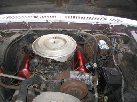 1979 Ford F-250 - The engine bay of a 1979 Ford F-250 shows its V8 engine, air cleaner, and brake booster.