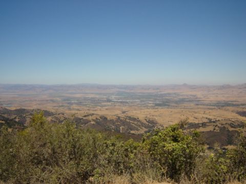 1991 Ford Bronco - Expansive landscape view from a hilltop overlooking a valley and distant mountain ranges.