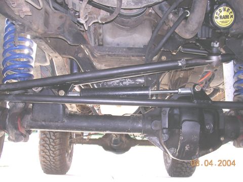 1994 Ford Bronco - Undercarriage view of a 1994 Ford Bronco, focusing on the steering and suspension system.