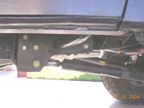 1994 Ford Bronco - Close-up of the vehicle's undercarriage, highlighting the frame and suspension system with a date stamp of 07.12.2004.