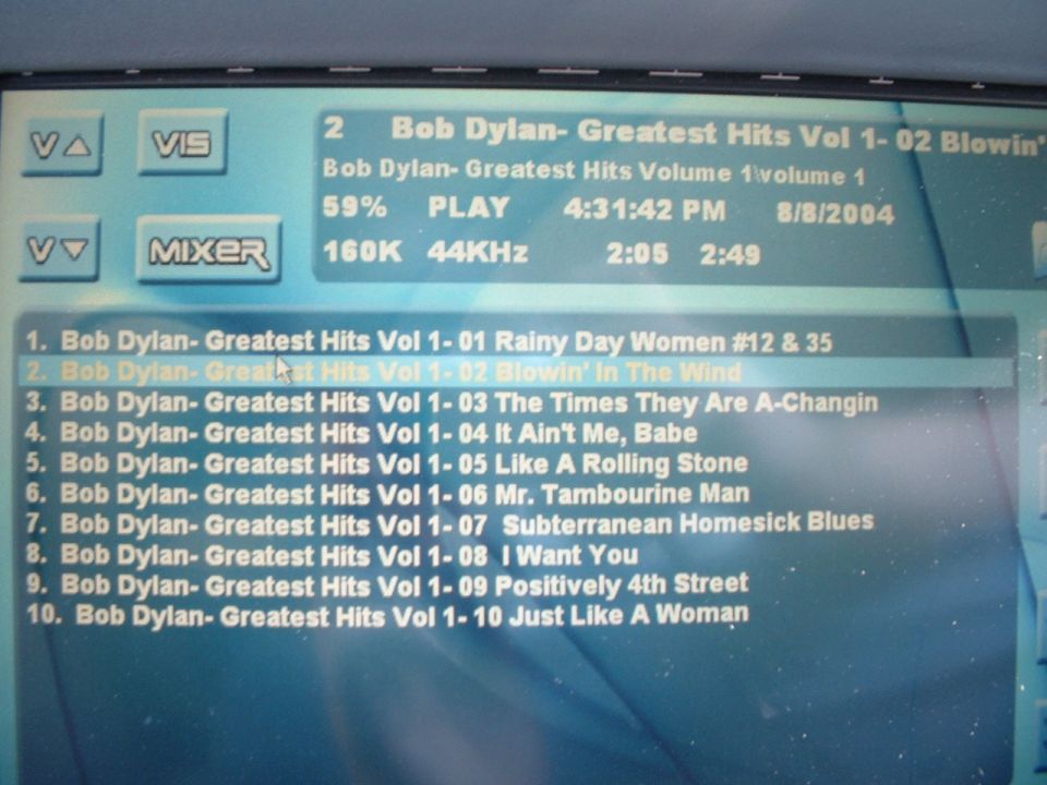 Music player screen showing Bob Dylan Greatest Hits track list