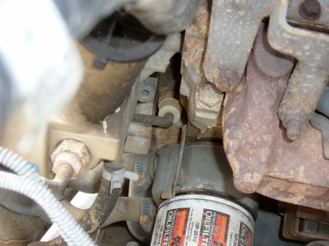 1995 Ford Bronco - Here you can see the stock "dumby" sender above the oil filter to the left, with the wire going to the left (it is tan in color) The sender…