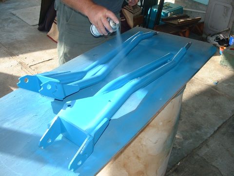 1990 Ford Bronco - Spray painting suspension components blue for a vehicle project.