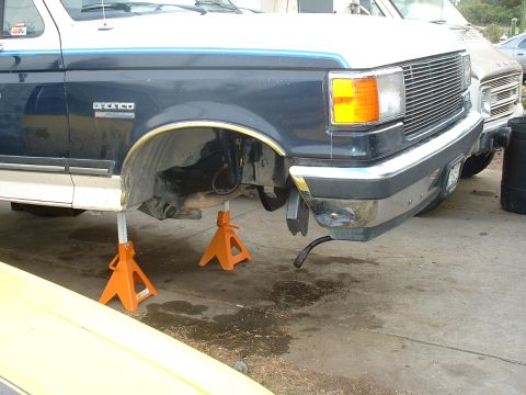 1990 Ford Bronco - This 1990 Ford Bronco is shown with its front end elevated on orange jack stands for maintenance.