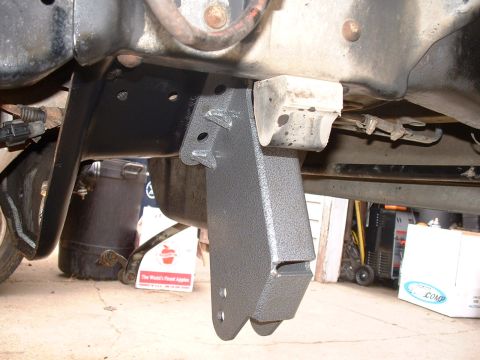 1990 Ford Bronco - Aftermarket lift kit bracket installed on vehicle frame.