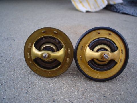 1993 Ford Taurus - The old and new thermostat.. $70 Ford Parts Department Item ONLY