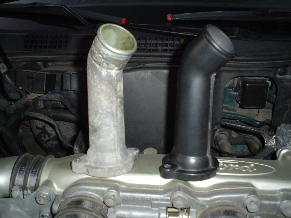 My smoothed, painted, thermostat housing compared with the original.