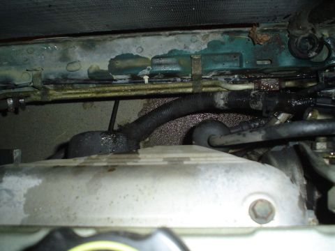 1993 Ford Taurus - The empty space where the radiator was is now covered in trans fluid.