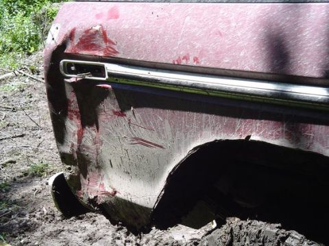 1995 Ford Bronco - Mike smashing in his rear panel after the snap strap yanked him into a tree while pulling Kevin out.