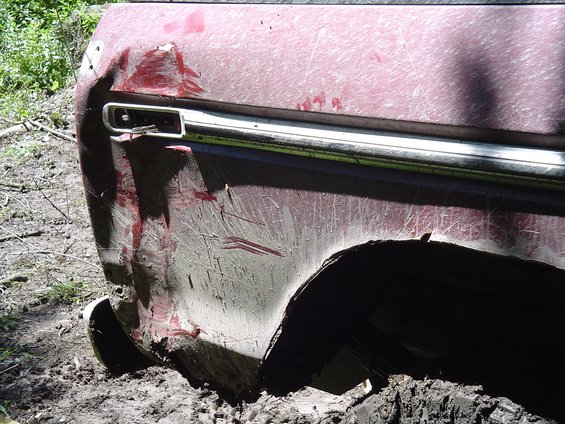 Mike smashing in his rear panel after the snap strap yanked him into a tree while pulling Kevin out.