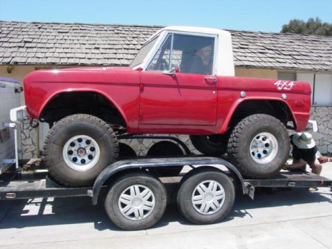 1992 Ford Bronco - First-generation Ford Bronco, likely from the late 1970s, being transported on a trailer.