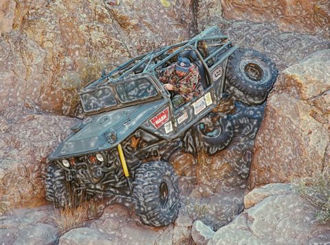 1995 Ford Bronco - Custom buggy navigates a steep, rocky terrain with extreme articulation.