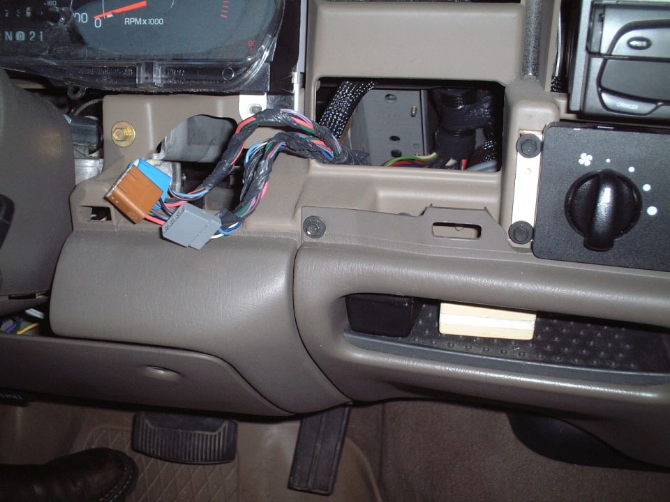 Getting ready to remove lower dash panel - close-up of 1 of the screws.
