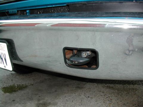 1994 Ford Bronco - A close-up view of a vehicle's front bumper, focusing on the tow hook mechanism.