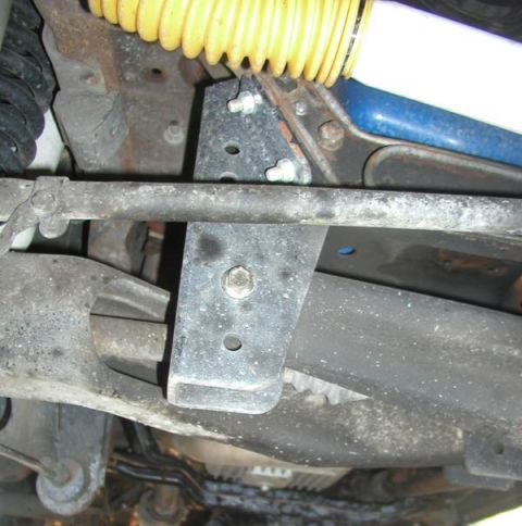 1988 Ford Bronco - Undercarriage view of a 1988 Ford Bronco, showing suspension and frame details.