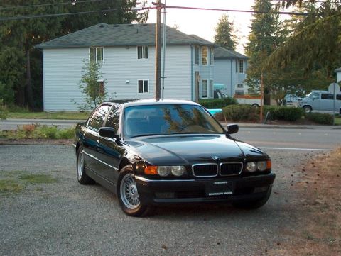1999 BMW 7 Series - Front view of a black 1999 BMW 7 Series sedan.