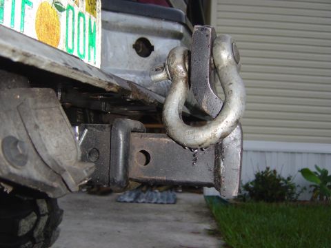 1993 Ford Bronco - A trailer hitch receiver is shown with a D-ring shackle attached, indicating towing or recovery capabilities.