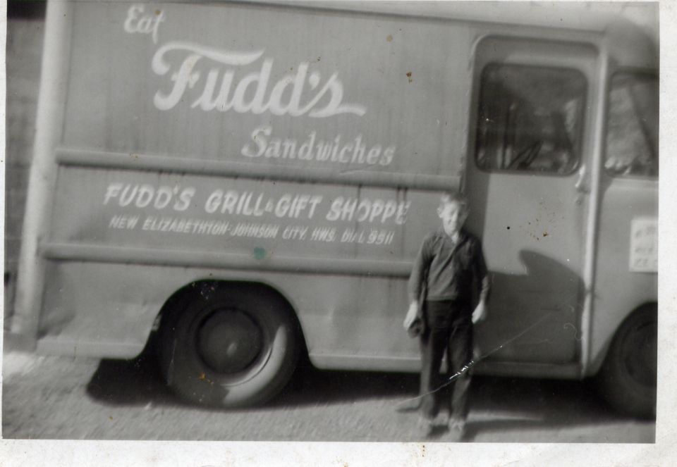 Side view of a delivery truck with 'Fudd's Sandwiches' and 'FUDD'S GRILL & GIFT SHOPPE' text