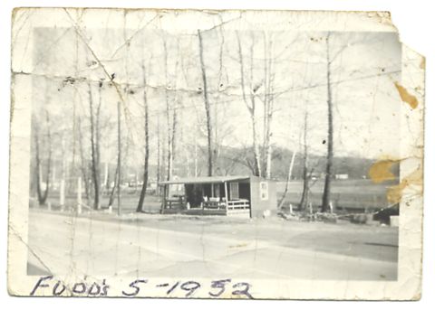 1995 Ford Bronco - A vintage photograph captures a scene with a small building and trees, dated "Food's 5-1952".